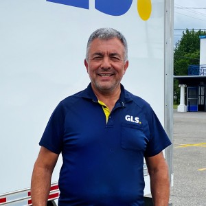 GLS Independent Contractor standing in front of cube van.