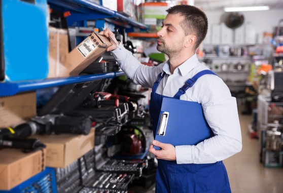 stocker stocking shelves in a warehouse
